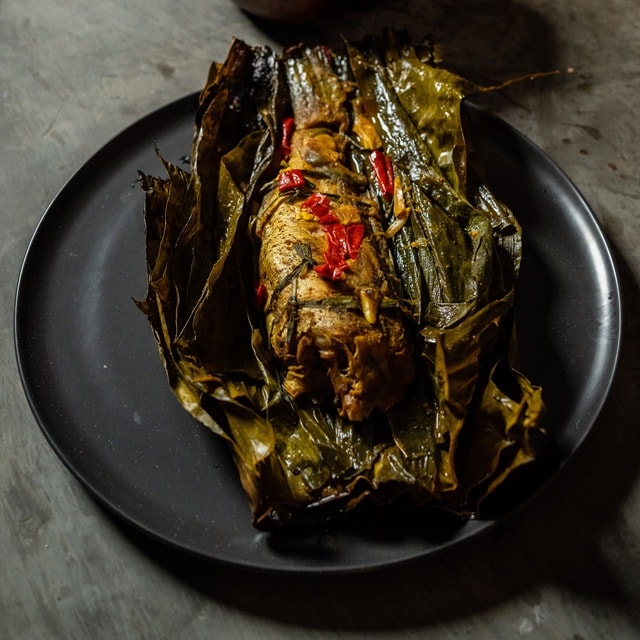 Pepes Pindang Fish Wrapped in Turmeric Leaves with Traditional Fried Spicy Sauce Pepes Pindang Fish Wrapped in Turmeric Leaves with Traditional Fried Spicy Sauce