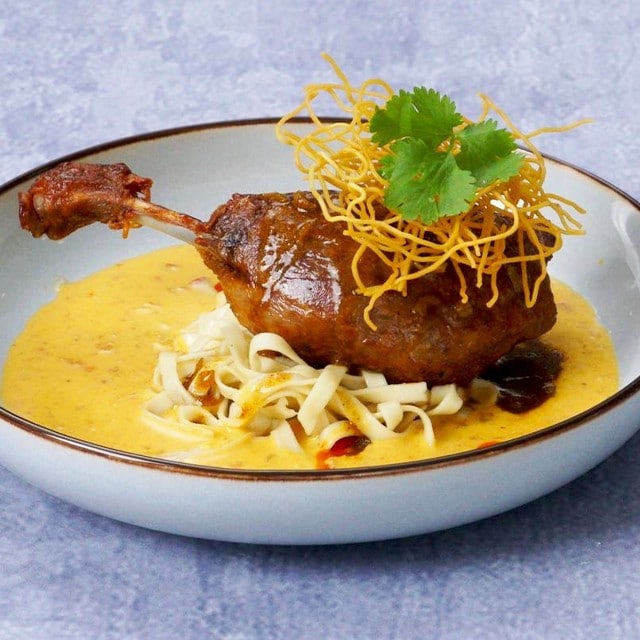 Duck Confit with Curry Demi-Glace and Khao Soi