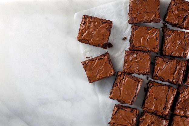 chocolate-brownie-on-paper-white-marble chocolate-brownie-on-paper-white-marble