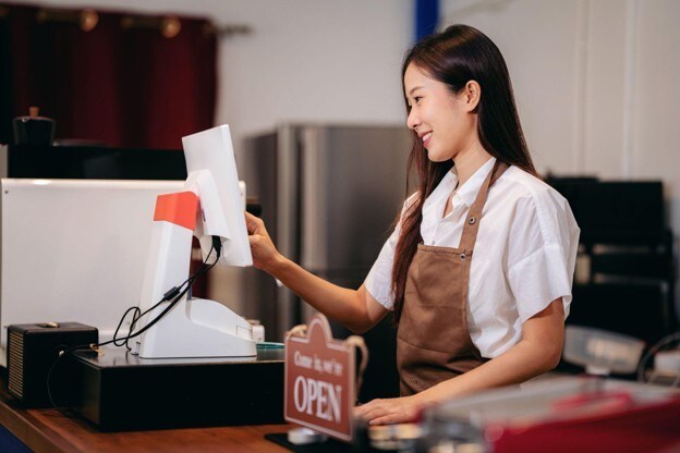 woman-sitting-counter-sign