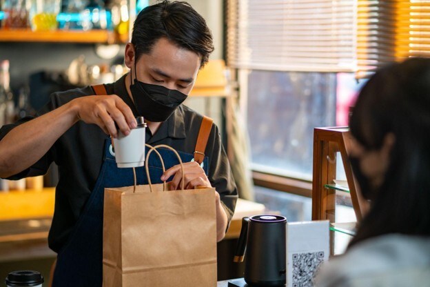 asian-man-barista-wear-protective-face